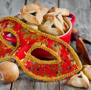 Hamantaschen pastries and a Purim mask