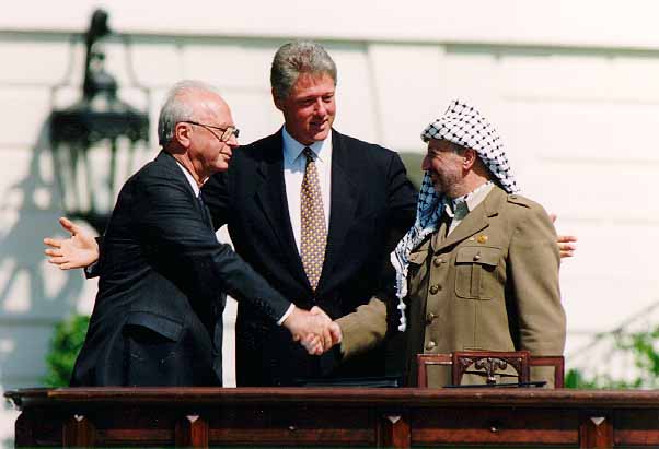 Israeli Prime Minister Yitzhak Rabin, U.S. President Bill Clinton, and Yasser Arafat at the Oslo Accords signing ceremony on 13 September 1993