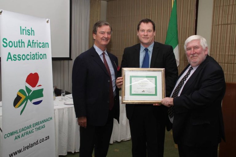 The author (centre) receiving the first Honorary Lifetime Membership of the ISAA (Irish South African Association) presented by His Excellency the Irish Ambassador, Brendan McMahon and the former President of the ISAA Chris Mahon (Source ISAA)