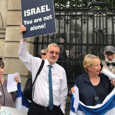 man with sign Ireland Israel Alliance pro Israel non profit organization Dublin